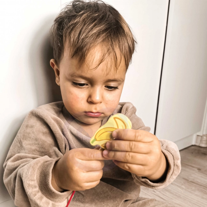 Blocs à enfiler en bois avec des fruits