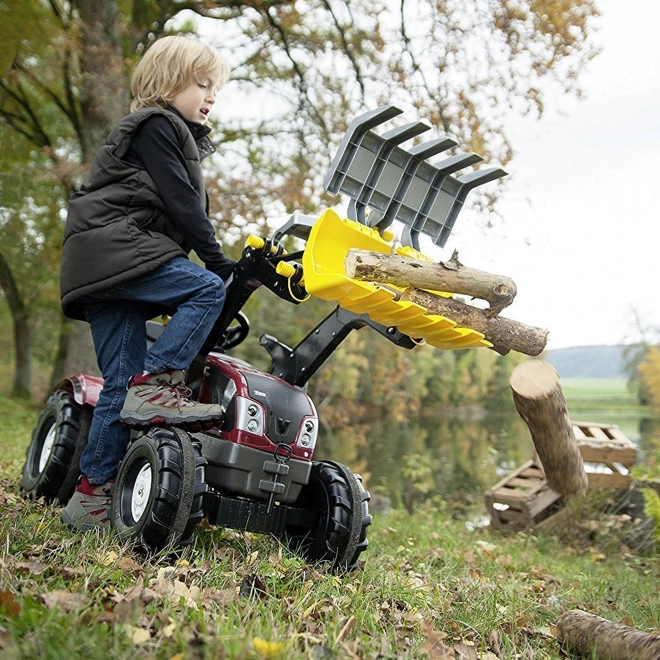 Pelle pour tracteur avec prise pour le chargement du bois