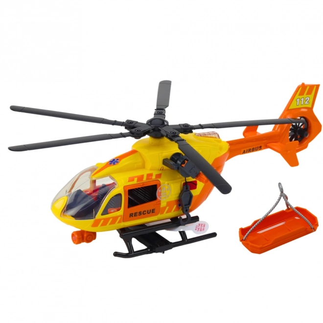 Hélicoptère de sauvetage avec crochet et brancard en lumière et son orange 1:12