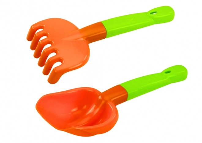 Ensemble coloré de jouets de sable avec moulin et moules