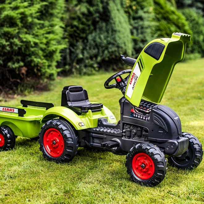Tracteur à pédales Claas Arion 410 avec remorque
