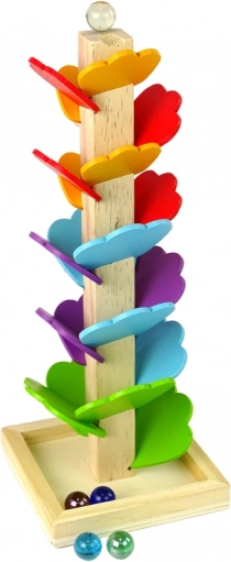 Déroulé fluide des billes sur des feuilles colorées