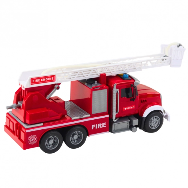 Grand camion de pompiers avec échelle extensible et fonction de jet d'eau