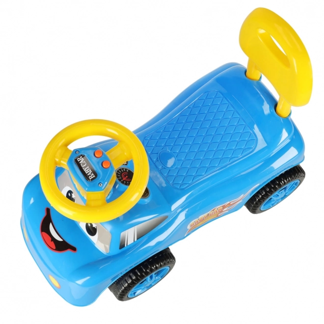 Voiture trotteur souriante avec klaxon bleu