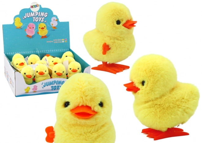 Poussin peluche jaune à remontage sautillant