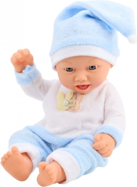 Poupée bébé en pyjama bleu avec bonnet à pompon