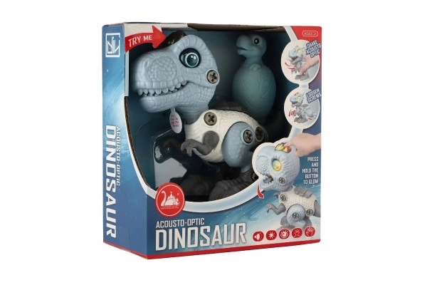Dinosaure à visser en plastique 12 cm avec tournevis fonctionnant sur piles avec lumière et son dans une boîte 15x16x7 cm