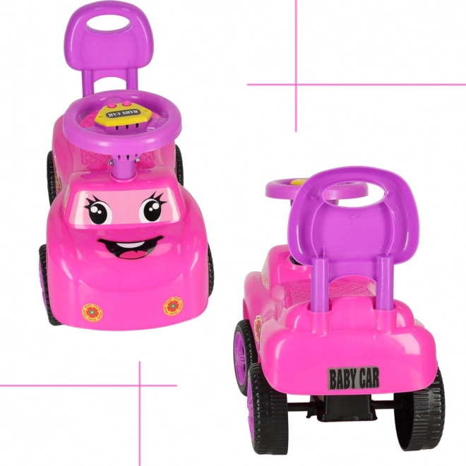Petite voiture rose avec klaxon