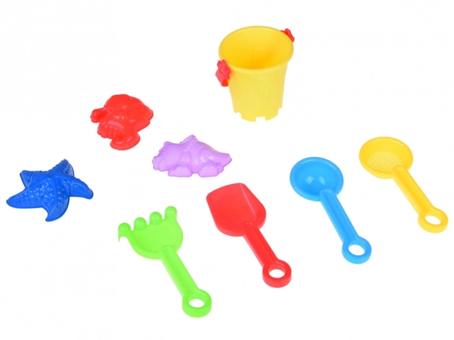 Ensemble coloré de jouets de sable avec seau et moules