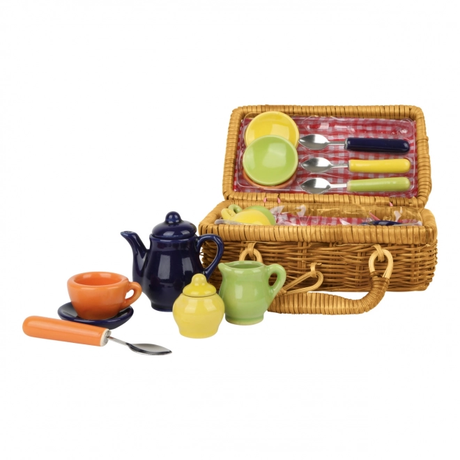 Petit panier de pique-nique avec vaisselle en céramique colorée