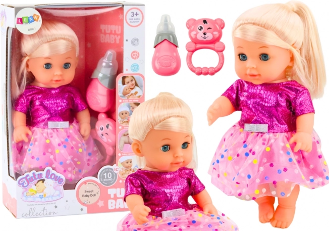 Poupée en robe rose avec biberon et hochet, avec sons et fonction pipi