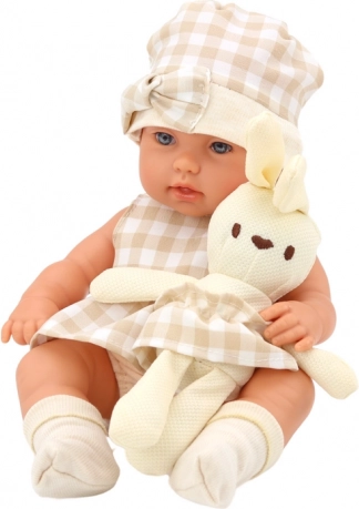 Poupée réaliste avec lapin en peluche