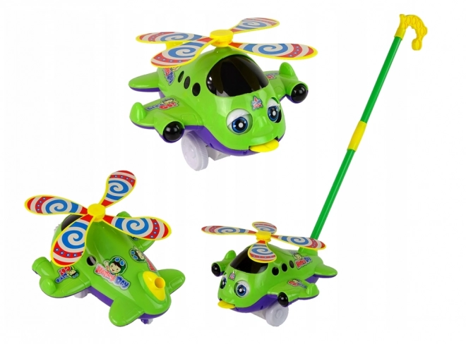 Avion pousseur vert avec longue canne et clochette