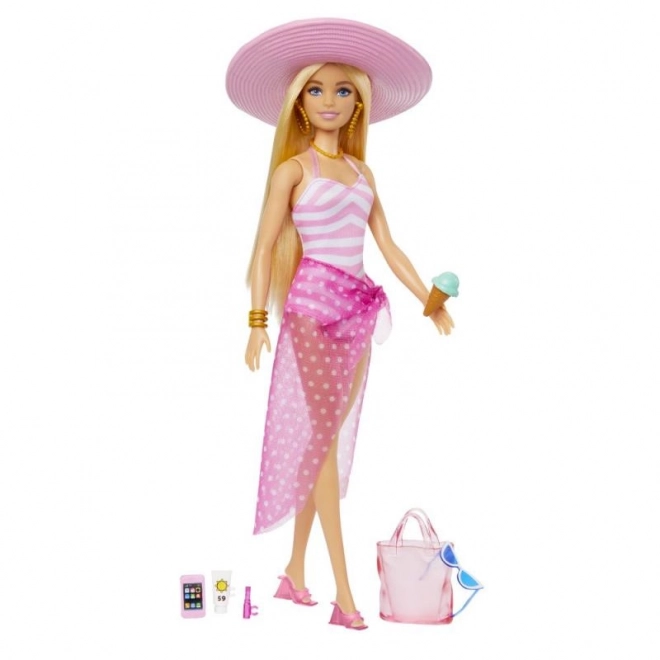 Barbie à la plage avec accessoires d'été