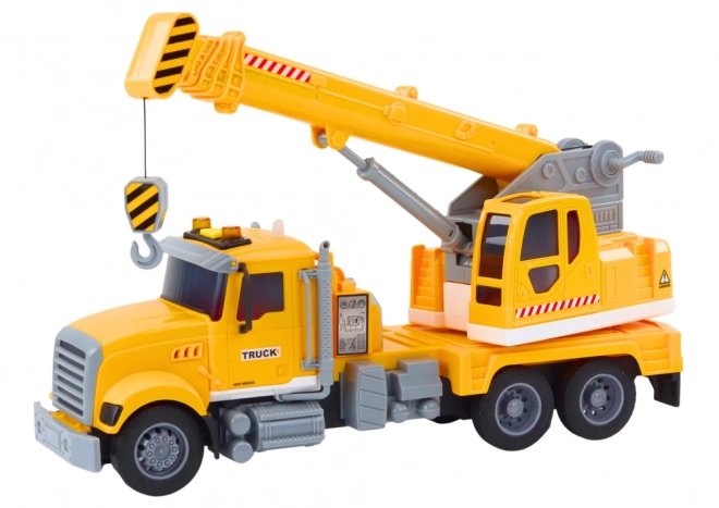 Grue de chargement jaune avec entraînement à friction et effets lumineux et sonores