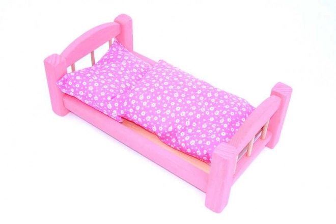 Lit de poupée en bois rose