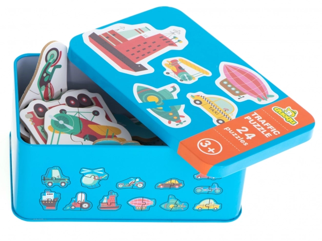 Puzzle avec motifs de moyens de transport dans une boîte en métal