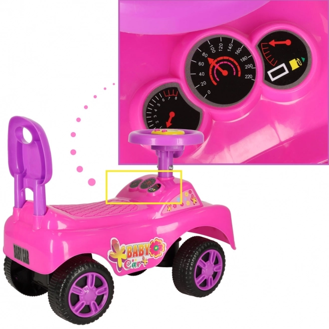 Petite voiture rose avec klaxon
