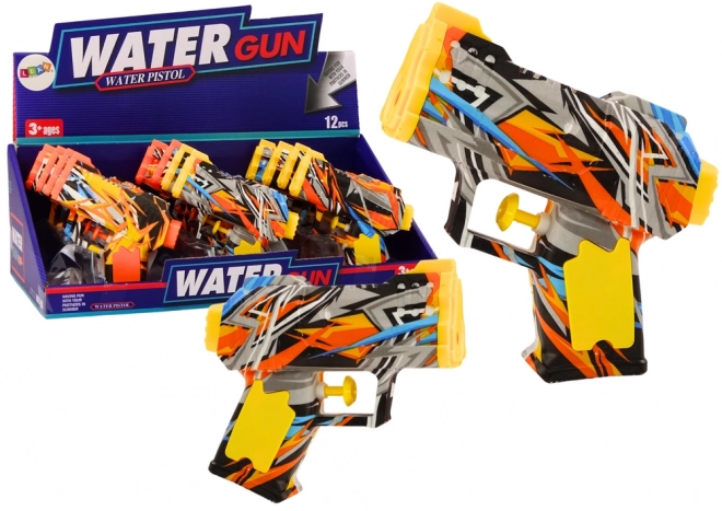 Petite pistolet à eau jaune orange graffiti