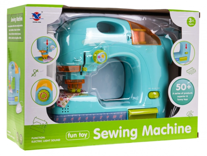 Machine à coudre bleue + accessoires