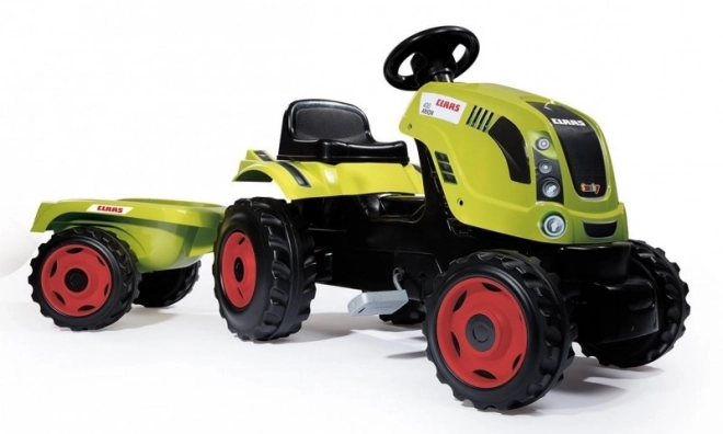 Tracteur à pédales CLAAS Arion 400 avec remorque verte