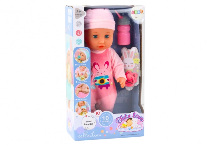Poupée bébé avec vêtements roses et effets sonores