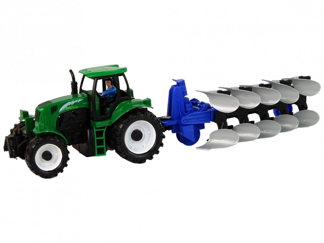 Tracteur agricole vert avec charrue