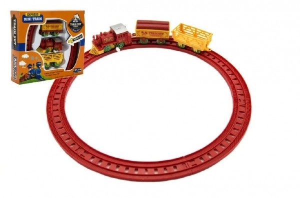 Train à clé avec deux wagons et pistes