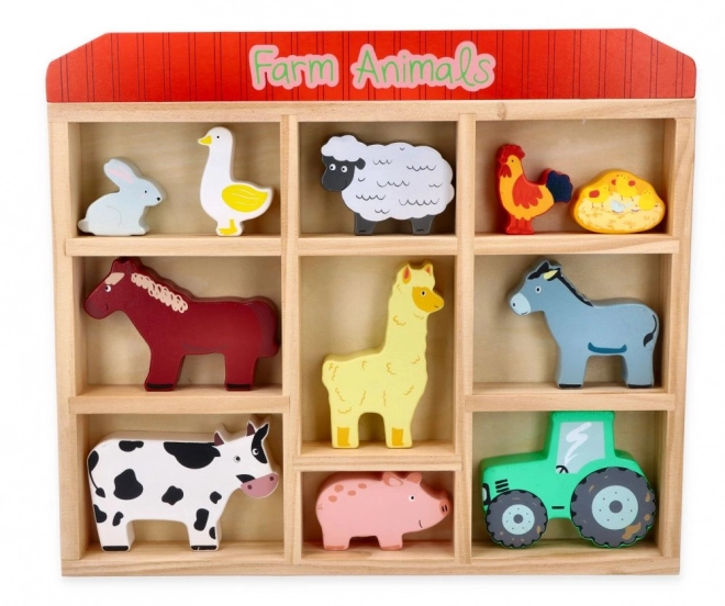 Ensemble d'animaux de ferme en bois dans un cadre