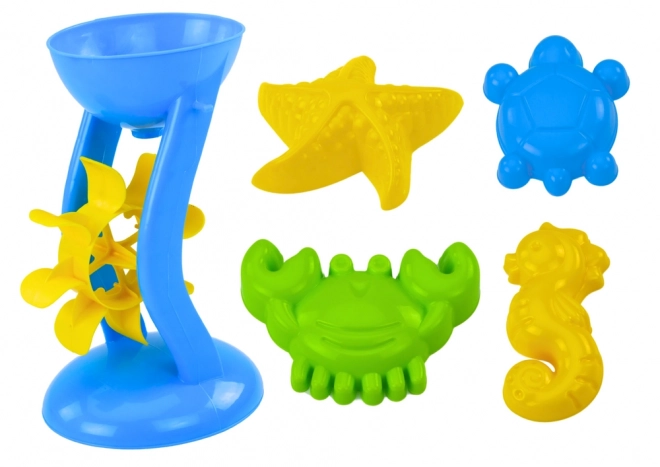 Ensemble coloré de jouets de sable avec moulin et moules