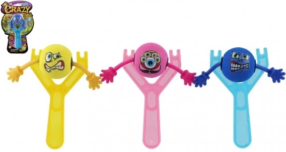 Lance-pierre en plastique avec smiley 14 cm en trois couleurs