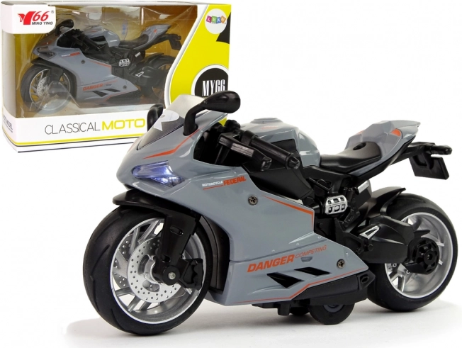 Moto sportive modèle 1:12 à rétrofriction, avec sons et lumières