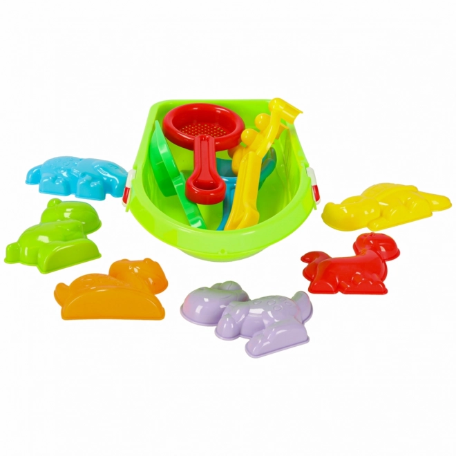 Lit d'enfant avec des jouets pour le sable et un pistolet à eau