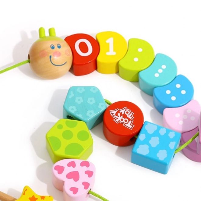 Chenille à lacets en bois TOOKY TOY