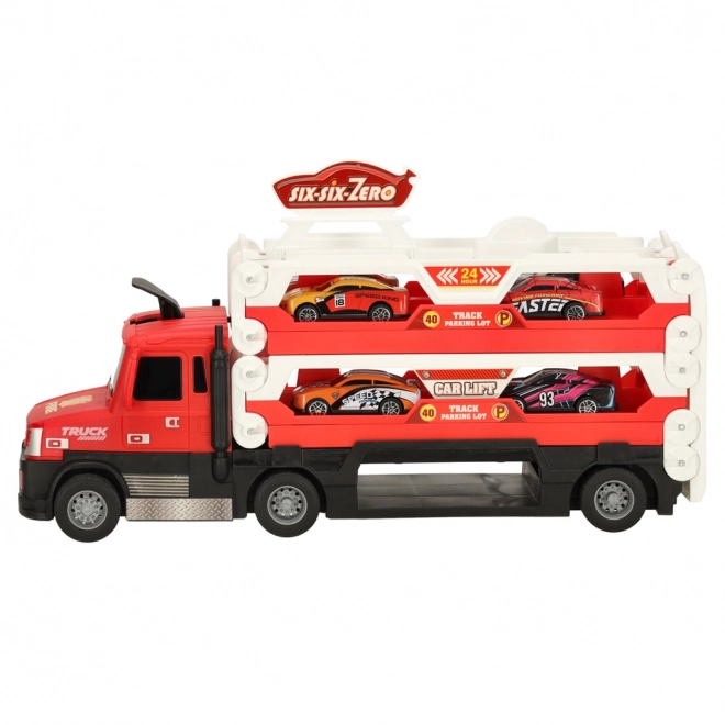 Camion rouge avec circuit caché et 6 petites voitures