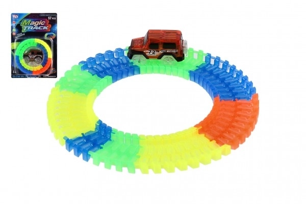 Circuit lumineux dans le noir + voiture à piles en plastique 57 pièces longueur 72cm sur carte 17x24x7cm