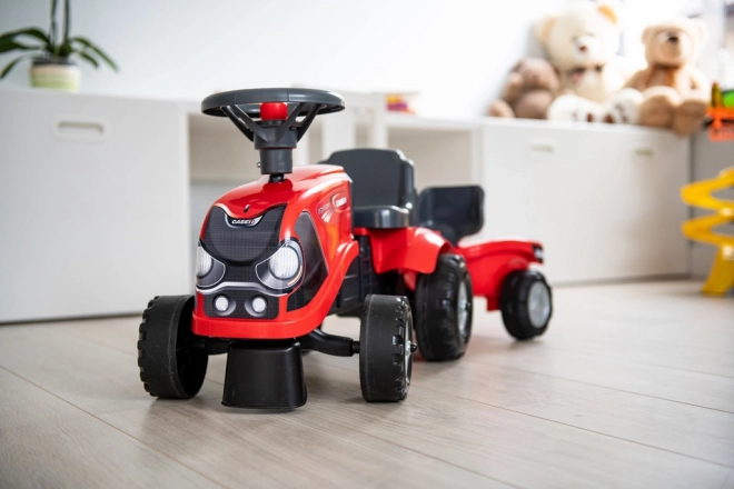 Tracteur à pédales Baby Case IH rouge avec remorque