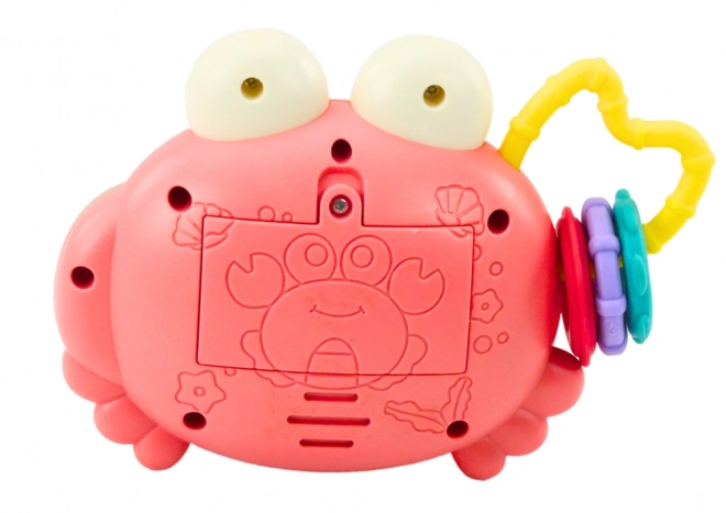Crabe interactif rose avec projecteur et hochet à piles