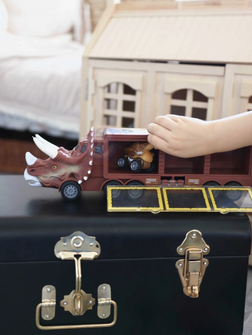 Camion dinosaure avec lanceur et petites voitures