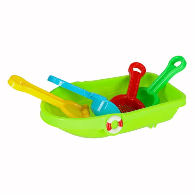 Lit d'enfant avec des jouets pour le sable et un pistolet à eau