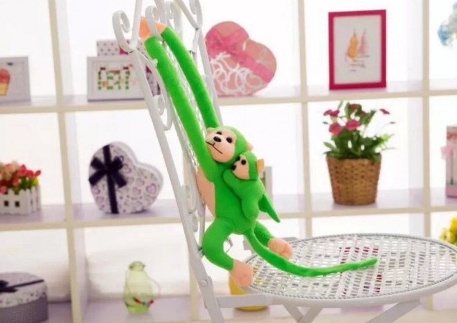 Singe en peluche avec petit vert 70 cm
