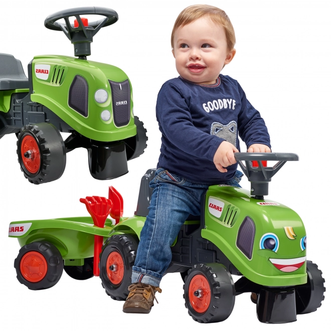 Tracteur pousseur Claas vert avec volant et remorque