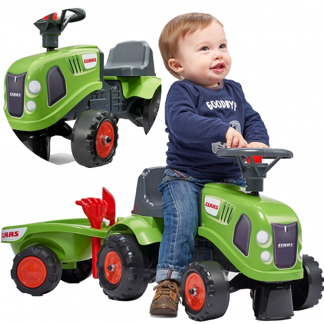 Tracteur pousseur Claas vert avec volant et remorque