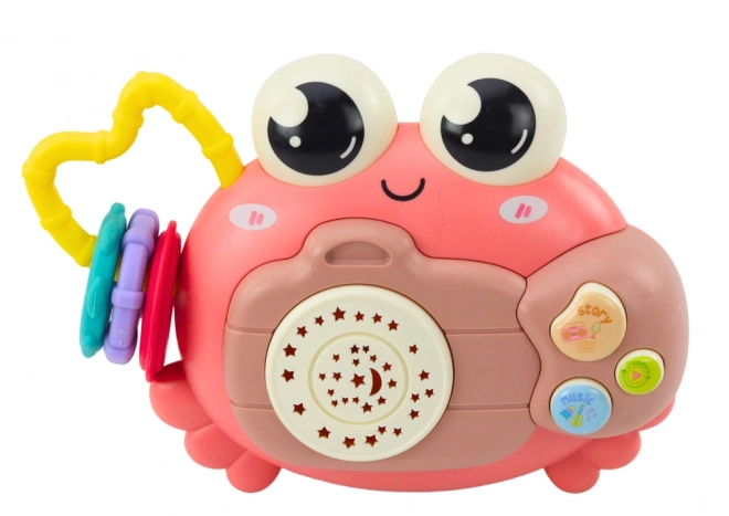 Crabe interactif rose avec projecteur et hochet à piles