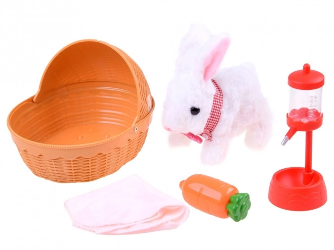 Lapin interactif dans un panier avec accessoires – Rose