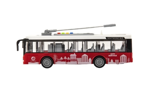 Autobus/trolleybus en plastique 28cm à inertie avec lumière et son dans une boîte 32x17x11cm