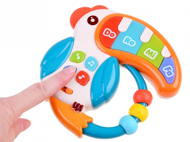 Jouet musical interactif toucan