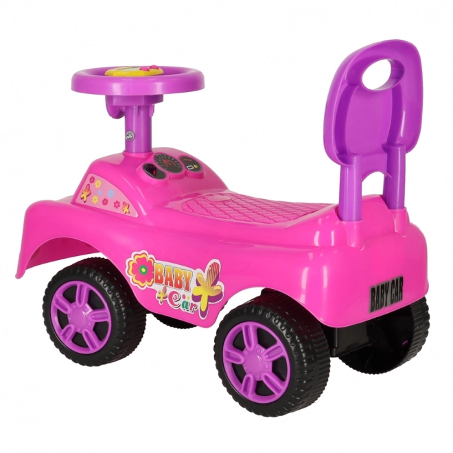 Petite voiture rose avec klaxon