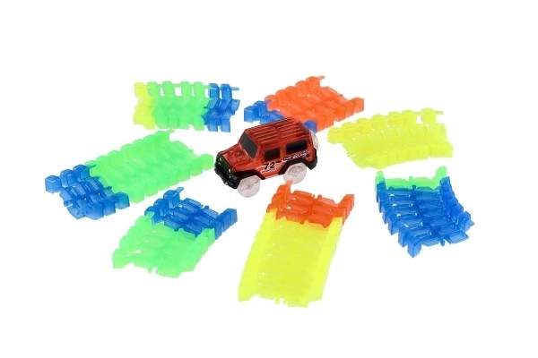 Circuit lumineux dans le noir + voiture à piles en plastique 57 pièces longueur 72cm sur carte 17x24x7cm