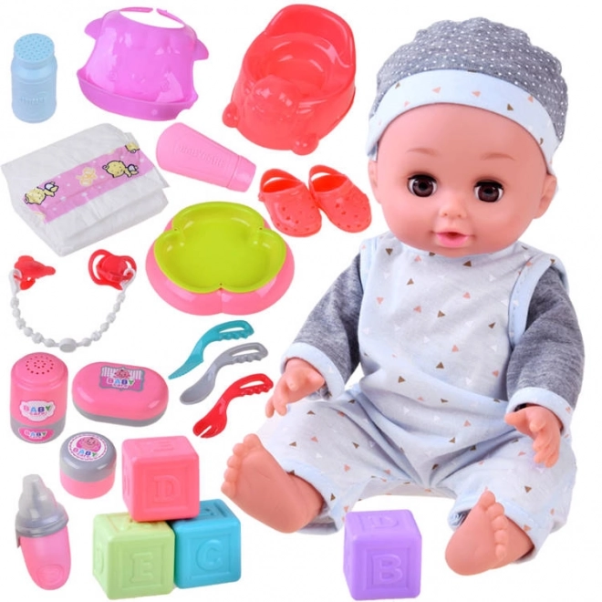 Poupée interactive bébé boit, fait pipi et parle